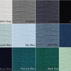 May include: A color chart showing 12 different fabric swatches. The swatches are arranged in a grid of four rows and three columns. The colors include silver gray, graphite, charcoal, deep black, grayish blue, sky blue, steel blue, blue, royal blue, peacock blue, dark teal, and mint.