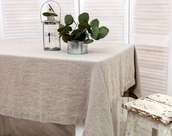 Washed linen tablecloth with decorative 1.5" edges and mitered corners. Table cloth in natural linen color. Available in 47 colors.