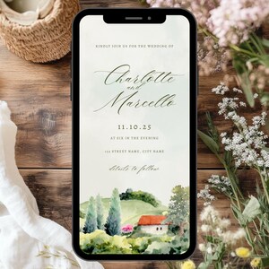 Könnte beinhalten: Ein Smartphone zeigt eine Hochzeitseinladung für "Charlotte und Marcello". Die Einladung enthält Datum, Uhrzeit und Ort sowie eine Aquarellillustration einer Landschaft. Das Telefon liegt auf einer Holzoberfläche.