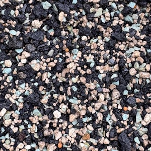 May include: Close-up of a mix of soil components. The image shows a blend of dark, porous, black pieces, light tan pebbles, small, light blue-green stones, and a few small orange granules. The texture is rough and varied, suitable for gardening.