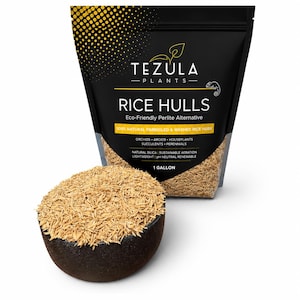 May include: A black stand-up pouch labeled TEZULA PLANTS RICE HULLS, 1 GALLON, containing natural parboiled and washed rice husks. A dark bowl filled with the light brown, fibrous rice husks sits in front of the pouch, which lists features like eco-friendly perlite alternative, natural silica, and sustainable aeration.