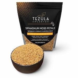 May include: A black pouch of Tezula Plants Sphagnum Moss Petals with a gold gradient top. The label reads Sphagnum cristatum & subnitens blend, AAA grade New Zealand stem-free moss petals, and 1 gallon loose fill. A dark bowl holds the moss.