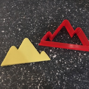 Emporte-pièce en forme de montagnes