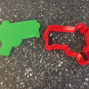 Cortador con forma de pistola de juguete