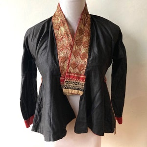 Small hand sewn black fine cotton jacket with gold couched embroidery panel collar. Hill tribe garment