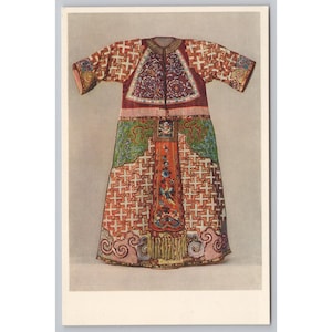 May include: An illustration of a traditional Chinese robe. The robe features a red and white cross pattern, with green and purple accents. The sleeves and hem are detailed with ornate designs.