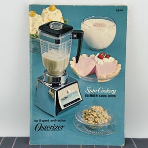May include: A vintage cookbook cover titled "Spin Cookery Blender Cook Book" featuring an Osterizer blender. The cover showcases the blender, along with images of food and the text "for 8-speed push-button Osterizer LIQUERER-BLENDER". The price is $100.