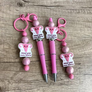 mind your own uterus, feminist, body autonomy, weighted beaded pens and keychains, journaling pen custom pen gift