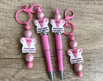 mind your own uterus, feminist, body autonomy, weighted beaded pens and keychains, journaling pen custom pen gift