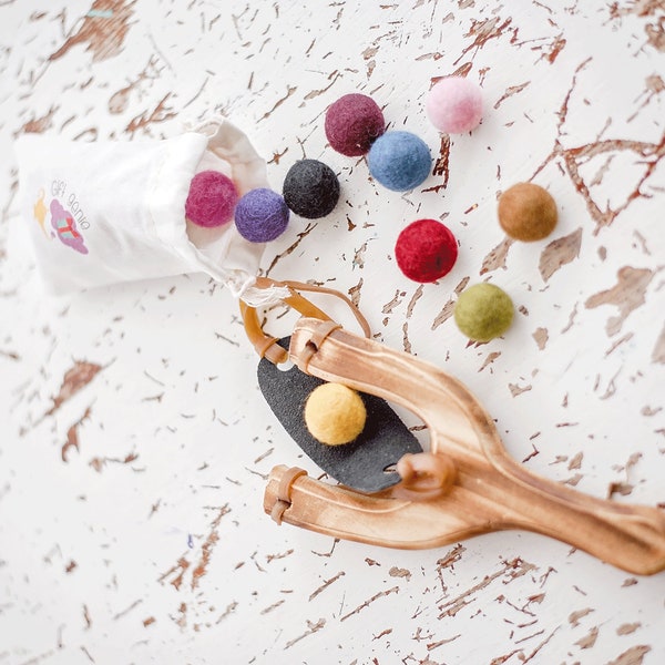 montessori inspired kids wooden sling shot with wool felt balls and muslin bag,  fun play outside busy toy