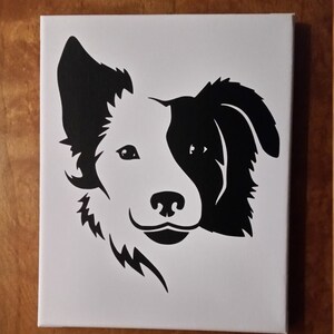 May include: Black and white silhouette of a Border Collie dog's head on a white canvas.