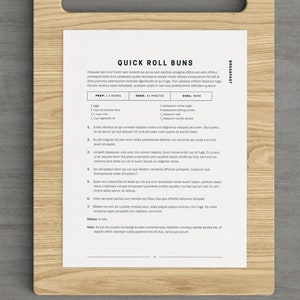 May include: A printable recipe card for quick roll buns. The recipe includes ingredients, instructions, and a note about the recipe's origins. The card has a white background with black text and a brown woodgrain background.