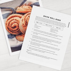 May include: A printable recipe card for quick roll buns. The recipe includes ingredients, instructions, and cooking times. The image shows a close-up of six golden brown rolls on a white and blue striped towel.