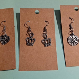 3 pair of silver-tone fashion earrings- crown heart and compass