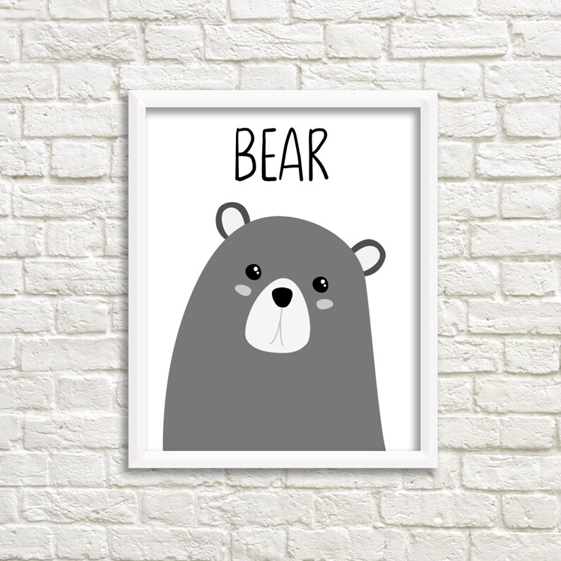 May include: A white framed print with a gray cartoon bear and the word "BEAR" in black text.