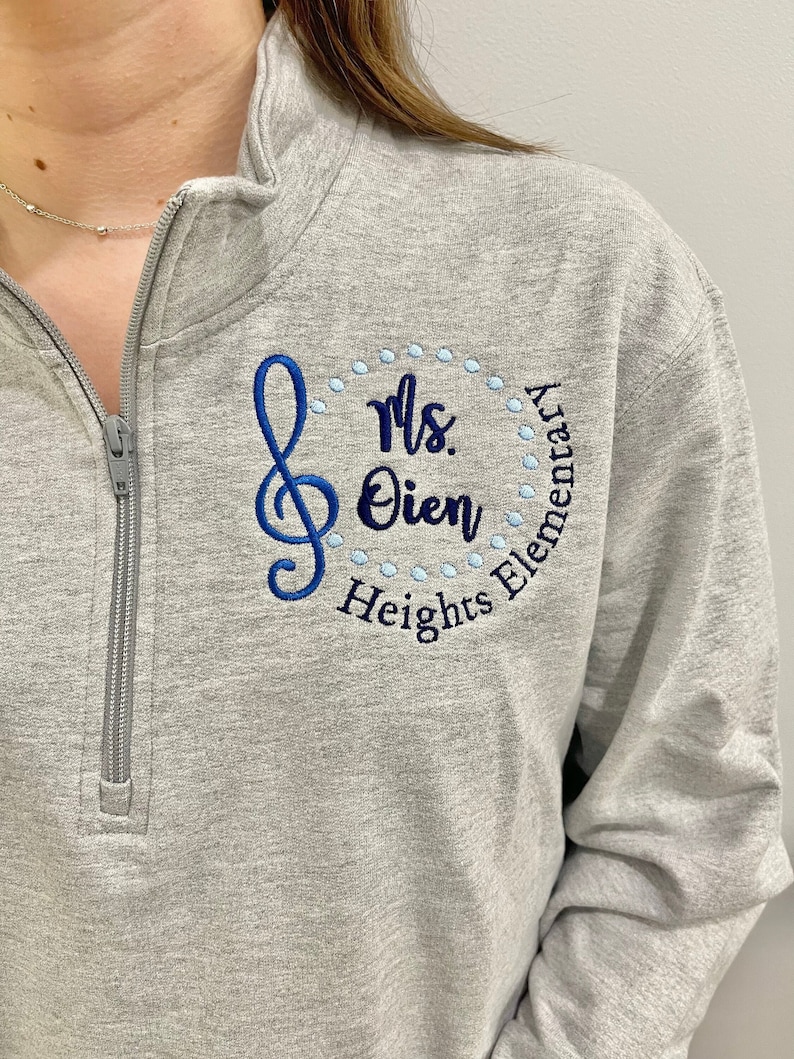 treble clef, custom personalized embroidery design, pullover quarter zip sweatshirt or full zip jacket with zippered pockets, hidden thumbholes, hooded hoodie, gray, black, royal blue, navy, teal, turquoise, pink, raspberry, coral, white, red