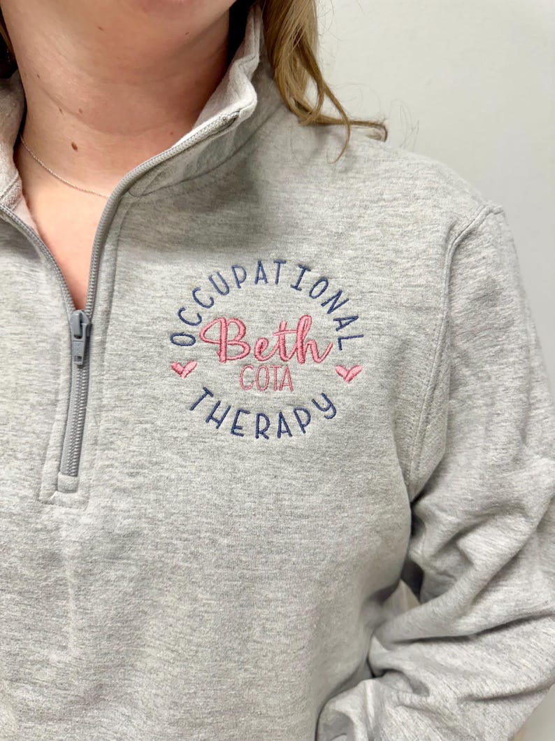 personalized occupational therapy sweatshirt, cute OT jacket, custom OT gift for coworker, wife, friend, mom, graduation gift for new OT, Christmas gift for OT, plus size available, S, M, L, XL, 2X, 3X, 4X, unisex sizes, ladies women sizes, hearts, name and title with credentials, embroidered, monogrammed, gray blue pink black navy royal white charcoal red green yellow gold silver pink teal turquoise rose gold blush hospital or clinic shirts, gifts for employees