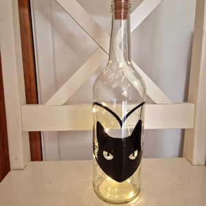 Biberon lumineux chat noir Beautiful