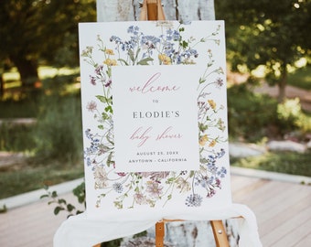 May include: A white welcome sign with a floral border and pink text that reads "Welcome to Elodie's Baby Shower August 25, 20XX Anytown, California".