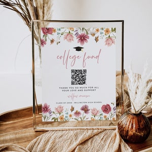 May include: A white sign with a floral border and a graduation cap graphic. The sign says "college fund" and includes a QR code. The text below the QR code says "Thank you so much for all your love and support Willow Monroe Class of 20XX Millington High School".