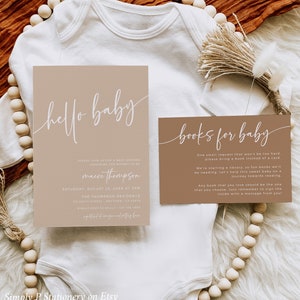 May include: A brown baby shower invitation with white text that says "hello baby" and includes the details for the event. A separate card with brown background and white text says "books for baby" and asks guests to bring a book instead of a card.