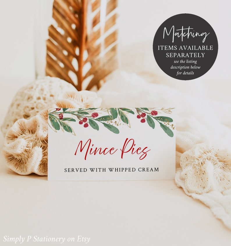 May include: A white rectangular card with the text "Mince Pies SERVED WITH WHIPPED CREAM" in red script. The card is decorated with a watercolor design of green leaves, red berries, and gold accents. A black circle with white text reads "Matching ITEMS AVAILABLE SEPARATELY see the listing description below for details."