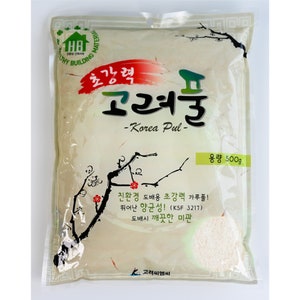 May include: A white bag of Korea Pul, a high-strength, eco-friendly wallpaper paste. The bag is labeled with the text "Korea Pul" and "500g". It also states that the paste is antibacterial and provides a clean finish.