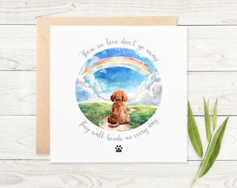 May include: A square greeting card with a watercolor illustration of a dog looking at a rainbow. The card has the text "Those we love don't go away, they walk beside us every day." A paw print is at the bottom.