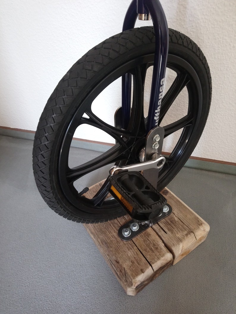 Bar stool from an bicycle and driftwood