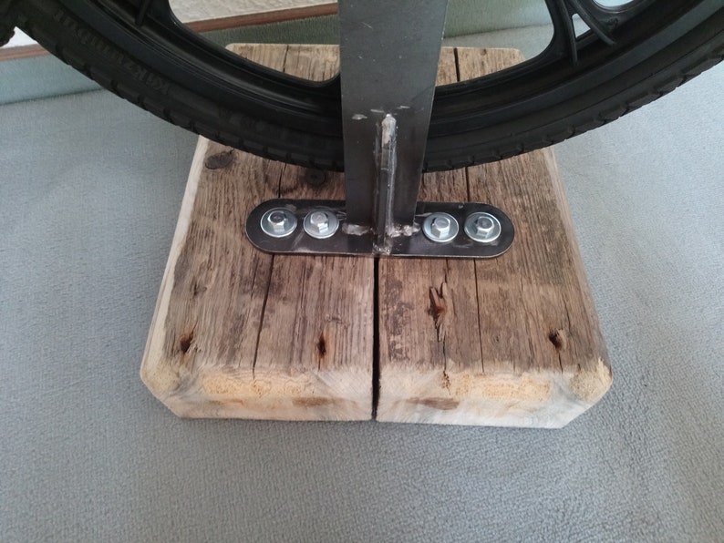 Bar stool from an bicycle and driftwood