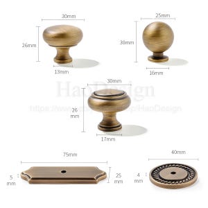 May include: A collection of antique brass cabinet hardware, including knobs and a backplate. The knobs vary in shape, with measurements provided in millimeters and inches. The hardware is designed for furniture and home decor projects.