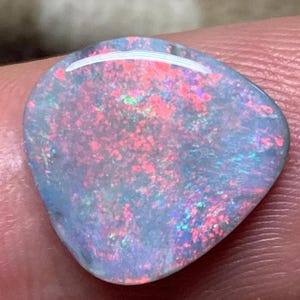 May include: A white ceramic mug with a black handle and the text "But First, Coffee" in a bold, black font. The mug is set against a neutral background, highlighting its simple design.