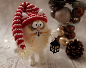 Wool felt white cat in striped elf cap and lantern, textile miniature cat needle felted, funny christmas decoration figurine felt cat