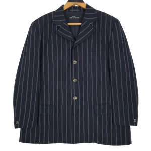 May include: Navy blue blazer with vertical white pinstripes. The blazer has a notched lapel, three-button closure, and a chest pocket. The brand name is visible on the label.