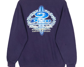 May include: A navy blue sweatshirt with a graphic on the back featuring a surfboard and the word "Piko". The graphic also includes the text "Hawaiian Longboard Wear" and "Paradise Of The Pacific". The sweatshirt is hanging on a wooden hanger.