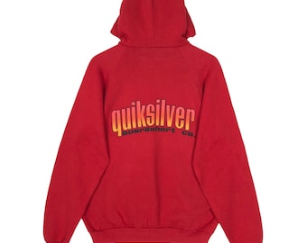 May include: A red hooded sweatshirt with the Quiksilver logo in a gradient of orange and yellow. The back of the sweatshirt is visible, showcasing the brand's name and the words "boardshort co."