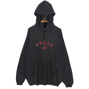 May include: Black hooded sweatshirt with a kangaroo pocket and drawstring. The word "SPLIT" is embroidered in red across the chest, with a red graphic below. The sweatshirt has a vintage, worn appearance.