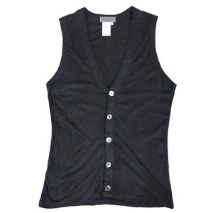 May include: A dark gray sleeveless button-up vest with a V-neck. The vest has six white buttons down the front and a small tag near the neckline. The fabric appears to be lightweight and slightly textured.