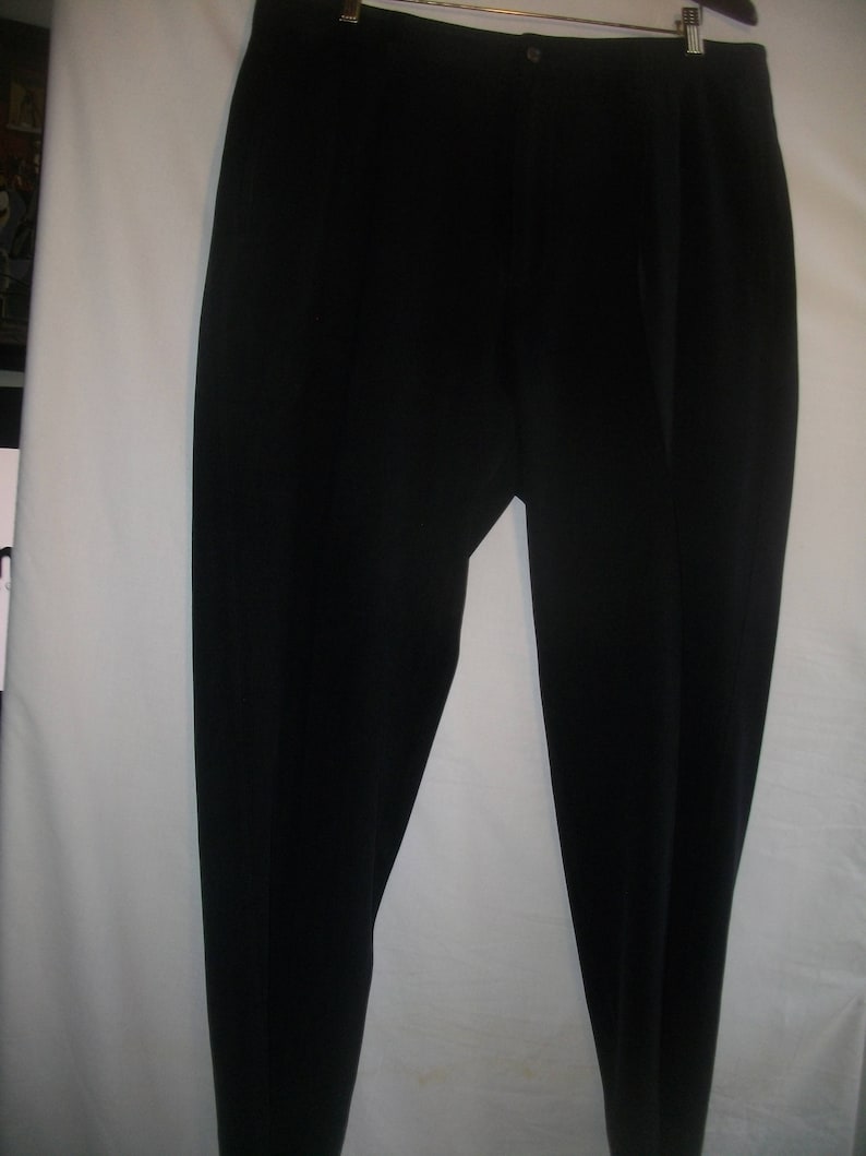 May include: A pair of black pleated pants.