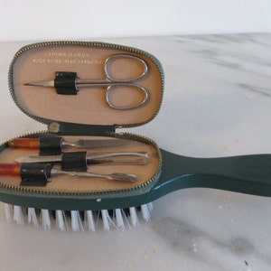 Vintage Leather Grooming Kit includes brush, scissors, tweazers, nail file and cutical tool.