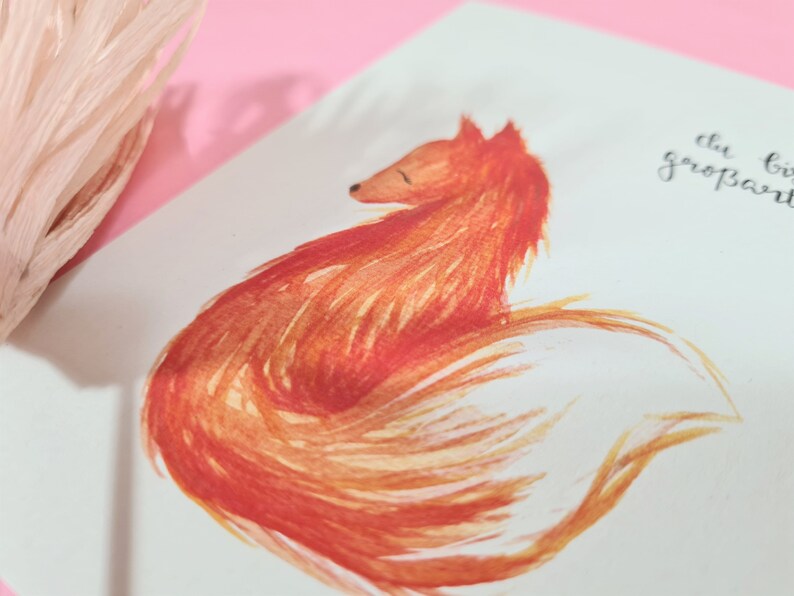 May include: A watercolor painting of a red fox curled up with its tail wrapped around its body. The fox is painted in shades of orange and yellow, with a white background.