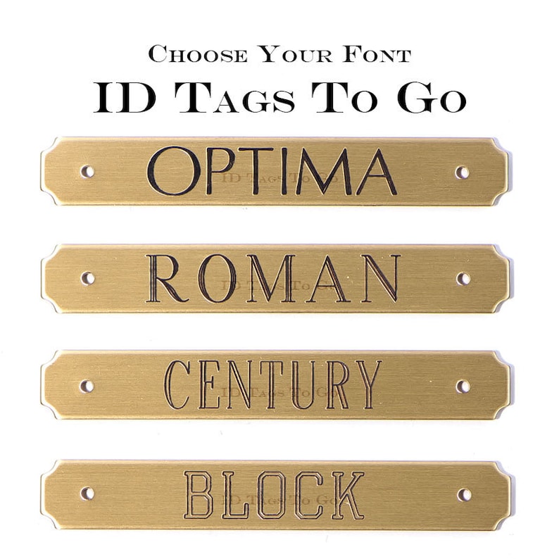 May include: Four gold-colored metal ID tags with different font styles: Optima, Roman, Century, and Block. The text "ID Tags To Go" is at the top of the image.
