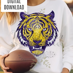 May include: A white sweatshirt with a gold and purple sequined tiger head design. The text "DIGITAL DOWNLOAD" is in the top left corner of the image.
