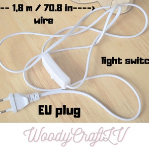 May include: White electrical cord with a white light switch and a European plug. The cord is 1.8 meters or 70.8 inches long. The text "Woody CraftLV" is visible in the bottom right corner.