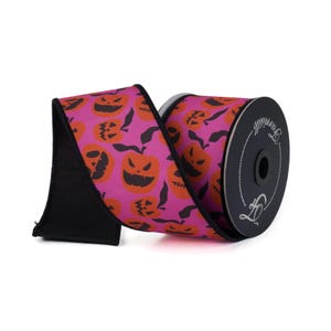 May include: A roll of pink and black ribbon with a Halloween pumpkin pattern. The ribbon is 2.5 inches wide and is on a spool.