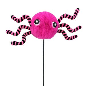 May include: A whimsical, plush pink octopus on a black stem. The octopus has large, googly eyes and black and pink striped tentacles. The toy is designed to be a decorative item or a playful accessory.