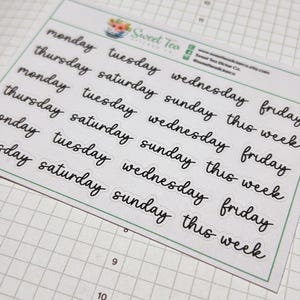 May include: A sheet of planner stickers featuring the days of the week in a handwritten style. The black stickers have a white border and the text "this week". The Sweet Tea Sticker Co. logo is in the top left corner.