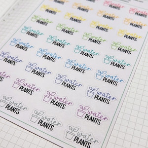 May include: A sheet of planner stickers with the words "Water Plants" in different colours. Each sticker has a small potted plant design. The stickers are arranged on a white background.