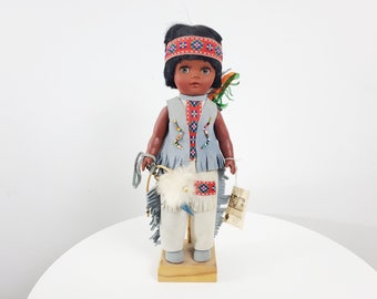 First Nations Doll with Leather Clothing, Bow and Arrow, Beadwork - Original Tag - Sleepy Eyes - Blue, Green, White and Red Trim
