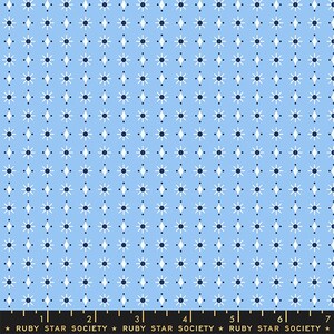 May include: A light blue fabric with a repeating pattern of white stars and dark blue diamonds.